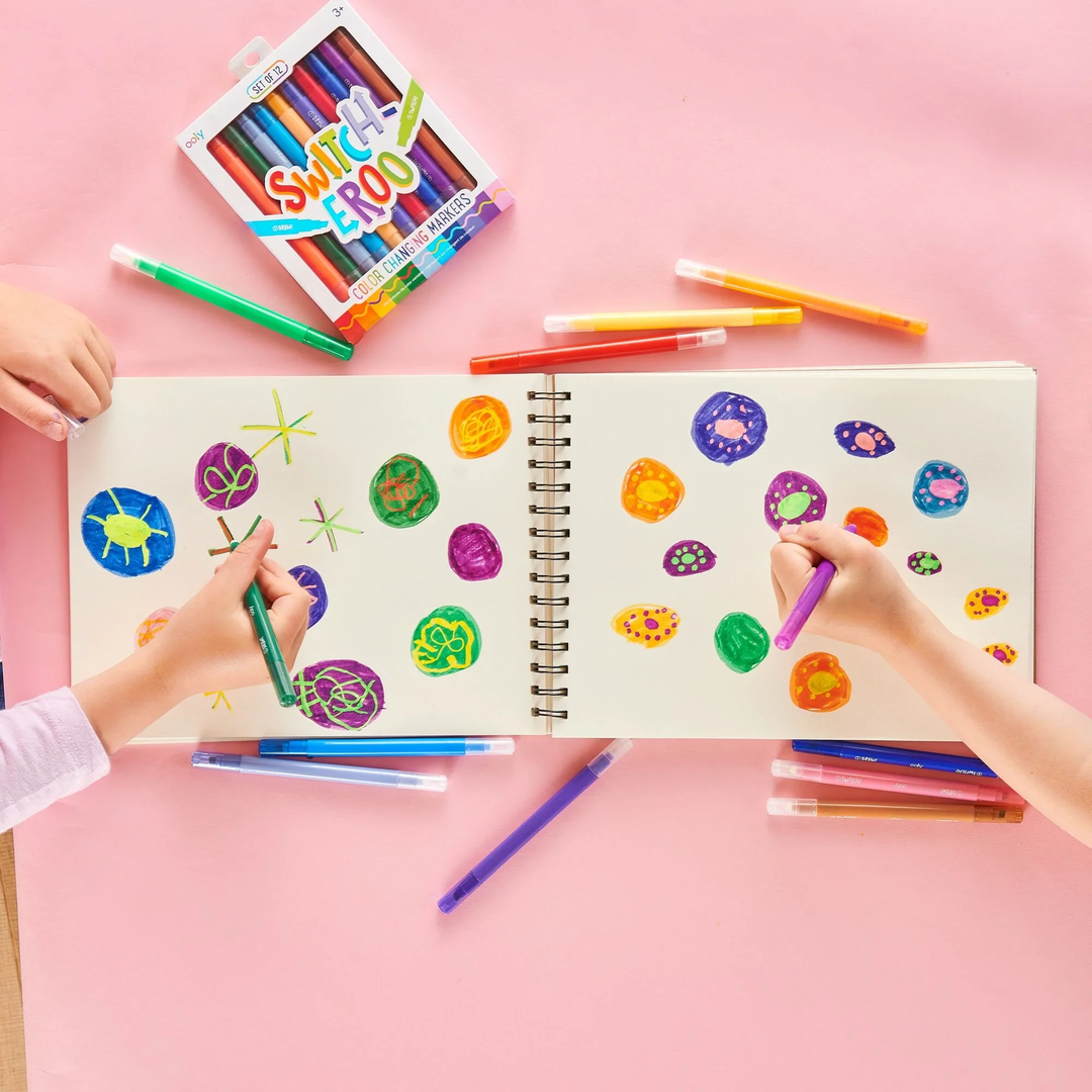 Two children coloring with OOLY Switch-Eroo color changing markers