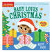Cover of Indestructibles: Baby Loves Christmas, illustrated by Becky Paige, showing a baby in a red Santa hat holding a wrapped present beside a Christmas tree and a stack of gifts