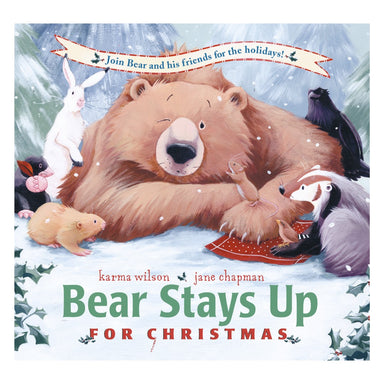 Cover of Bear Stays Up for Christmas by Karma Wilson and Jane Chapman, showing a big brown bear lying in the snow surrounded by a hare, badger and other woodland friends