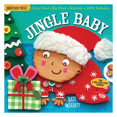 Cover of Indestructibles: Jingle Baby by Kate Merritt, showing a smiling baby in a red Santa hat holding a green wrapped present beside a Christmas tree