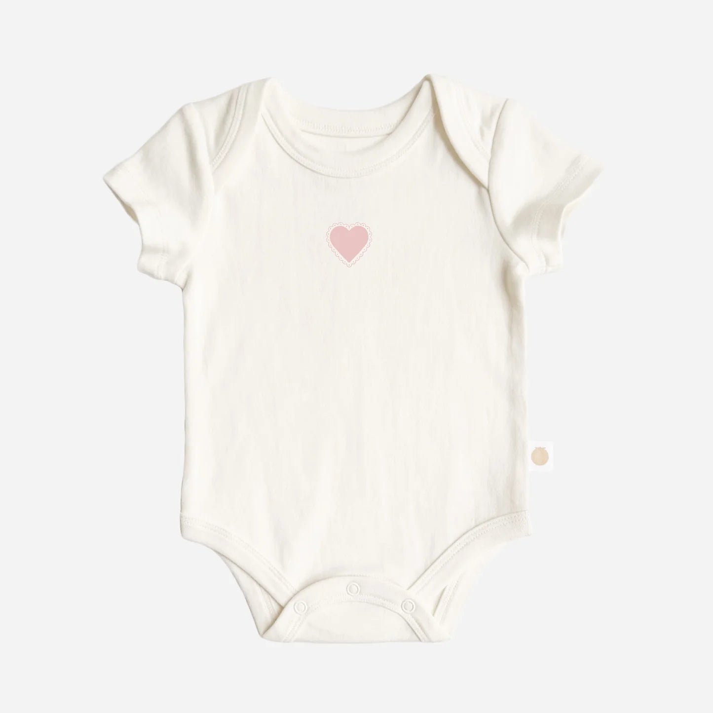 Cream baby onesie with pink heart